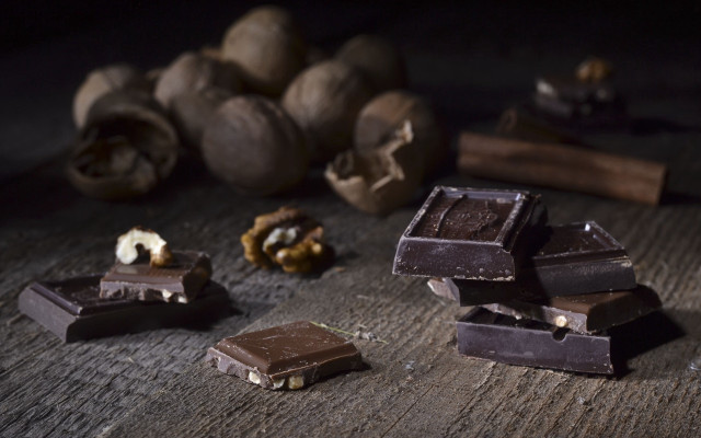 Chocolate nuts pile wooden table free wallpaper for desktop - medium preview image