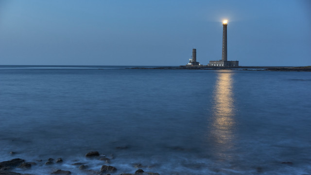 Lighthouse moonlit ocean shore tiltshift free wallpaper for desktop - medium preview image