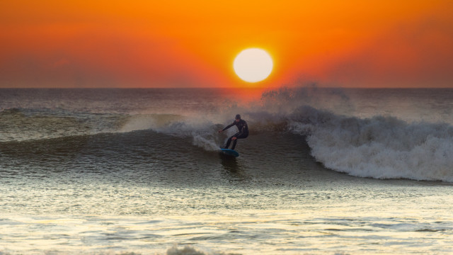 Surfer wave sunset ocean mountain free wallpaper for desktop - medium preview image