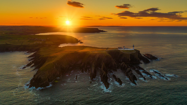 Sunset lighthouse island water sky free wallpaper for desktop - medium preview image