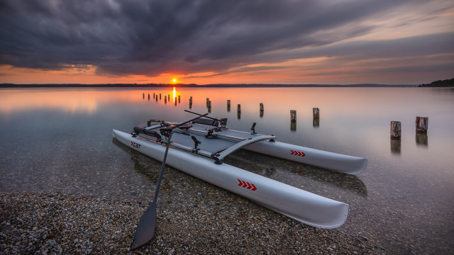 Kayak shore lake sunset cloudy free wallpaper for desktop - medium preview image