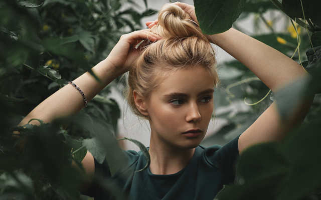 Woman bun tree serious portrait free wallpaper for desktop - medium preview image