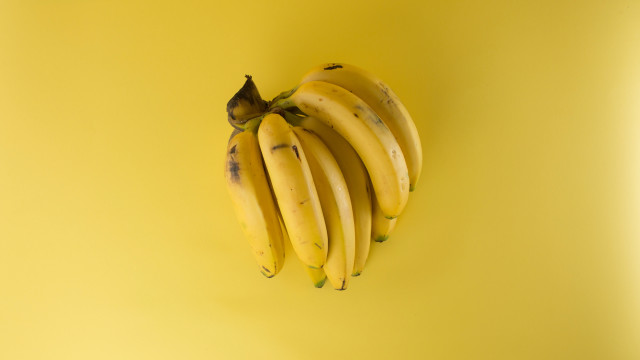 Bananas yellow background black stem free wallpaper for desktop - medium preview image