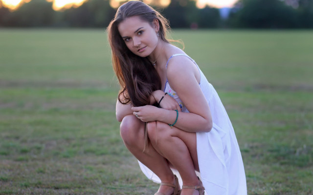 Woman white dress kneeling field free wallpaper for desktop - medium preview image