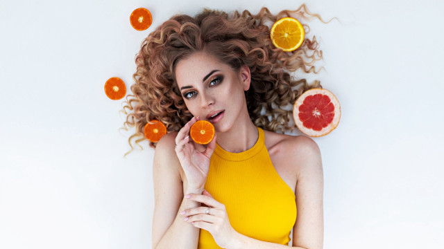Woman curly hair oranges wind free wallpaper for desktop - medium preview image