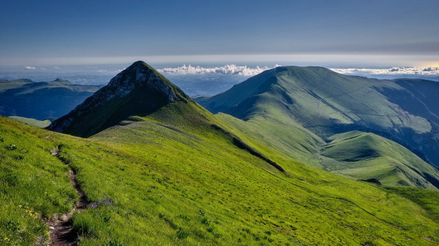Grassy mountain trail clouds nature free wallpaper for desktop - medium preview image