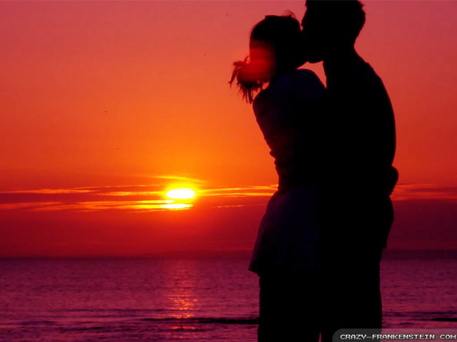Couple kissing sunset beach silhouette #2 free wallpaper for desktop - medium preview image