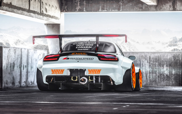 White car orange rims parking free wallpaper for desktop - medium preview image