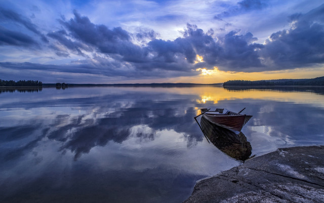 Boat sunset clouds rock outcrop free wallpaper for desktop - medium preview image