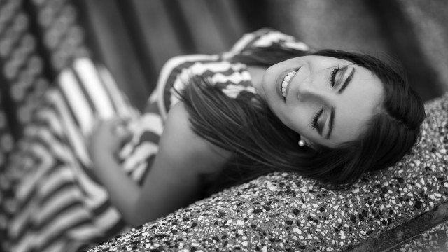 Woman wall blurry grayscale portrait free wallpaper for desktop - medium preview image