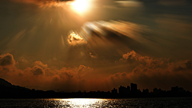 Sunset city clouds bright sunbeam free wallpaper for desktop - medium preview image