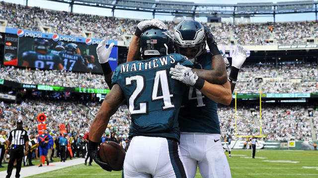 Football players hugging field crowd free wallpaper for desktop - medium preview image