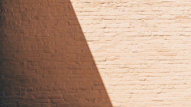 Brick wall skateboard shadow minimalist free wallpaper for desktop - medium preview image