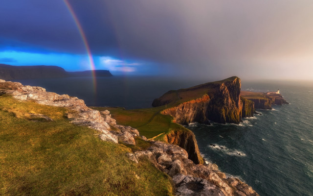 Rainbow ocean cliffs grassy mountains free wallpaper for desktop - medium preview image