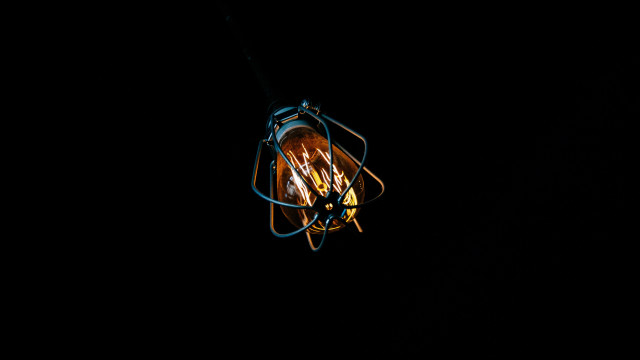 Lit bulb dark wire wrapped free wallpaper for desktop - medium preview image