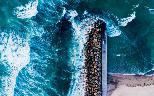 Pier rocks ocean beach tiltshift free wallpaper for desktop - medium preview image