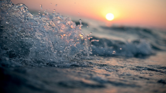 Wave breaking beach sunset ocean free wallpaper for desktop - medium preview image