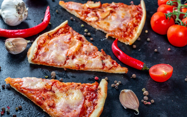 Pizza slices vegetables black surface free wallpaper for desktop - medium preview image