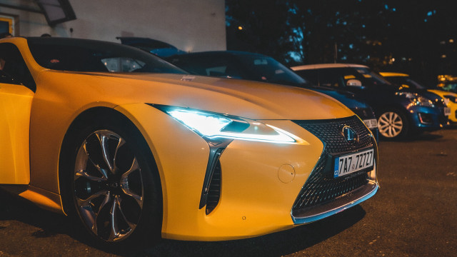 Yellow car night parking starry free wallpaper for desktop - medium preview image