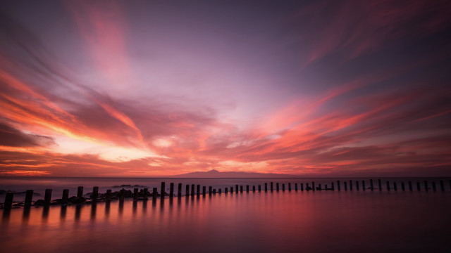 Sunset water fence mountains sky free wallpaper for desktop - medium preview image