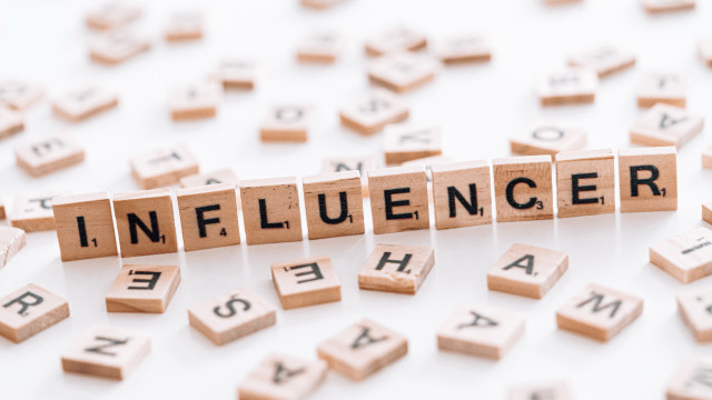 Influencer scrabble letters white surface free wallpaper for desktop - medium preview image