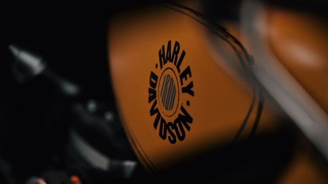 Motorcycle logo closeup black background free wallpaper for desktop - medium preview image