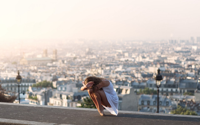 Cityscape woman ledge blurry architecture free wallpaper for desktop - medium preview image