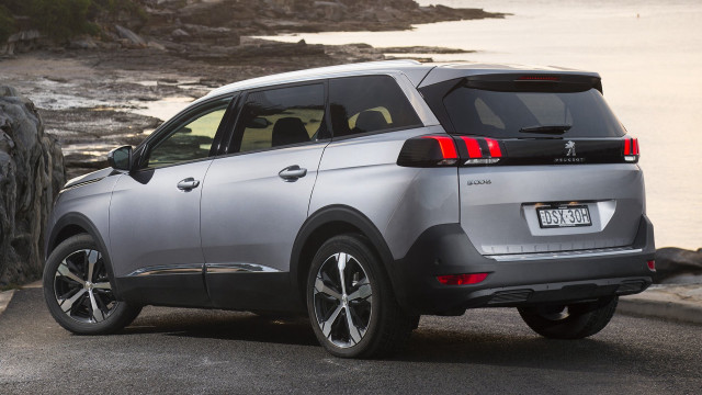 Silver car ocean rocks hyperrealism free wallpaper for desktop - medium preview image