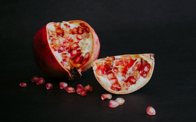 Pomegranate halved scattered food photography free wallpaper for desktop - medium preview image
