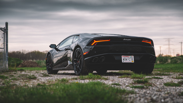 Black sports car field cloudy free wallpaper for desktop - medium preview image
