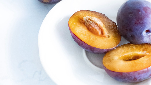 Plums halved whole table white free wallpaper for desktop - medium preview image