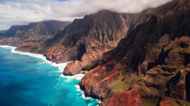 Mountain ocean plane view cliffs free wallpaper for desktop - medium preview image