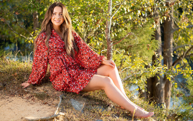Woman red dress sitting rock free wallpaper for desktop - medium preview image