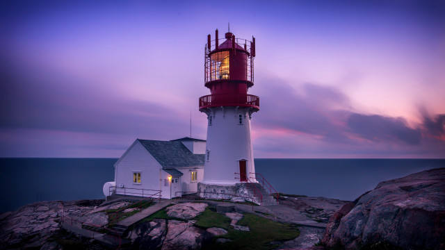 Lighthouse rocky shore purple sky free wallpaper for desktop - medium preview image