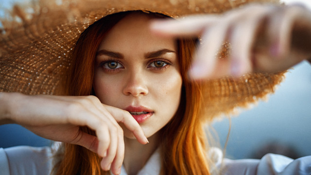 Woman hat pointing blurry portrait free wallpaper for desktop - medium preview image