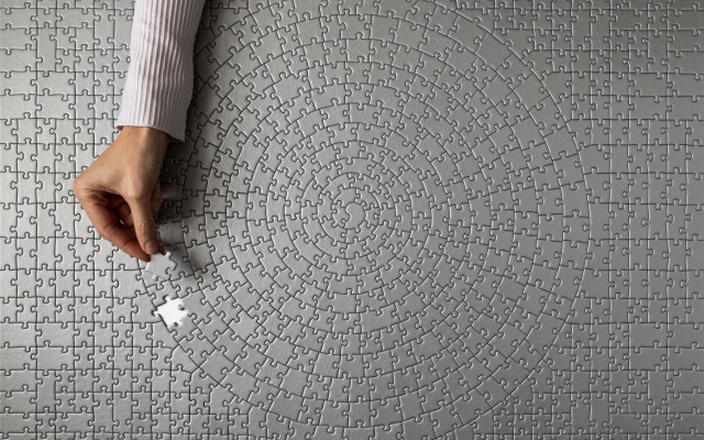 Puzzle hand circular pattern intricate free wallpaper for desktop - medium preview image