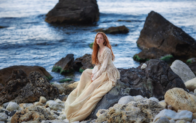 Woman sitting rock ocean smile free wallpaper for desktop - medium preview image