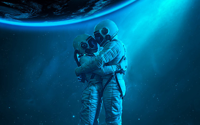 Space astronaut hug planet stars free wallpaper for desktop - medium preview image