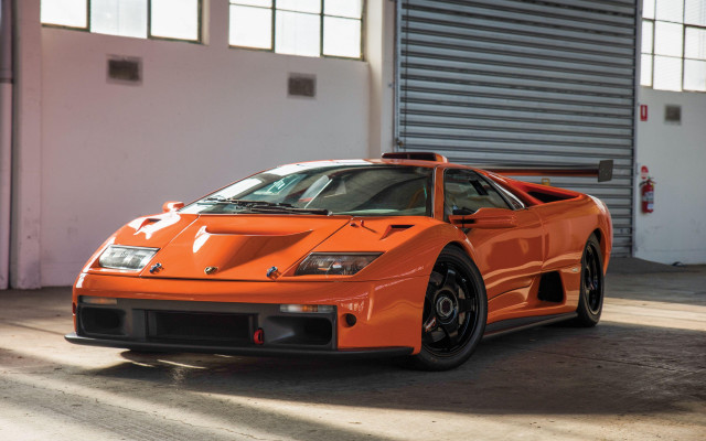 Orange sports car garage precisionism free wallpaper for desktop - medium preview image