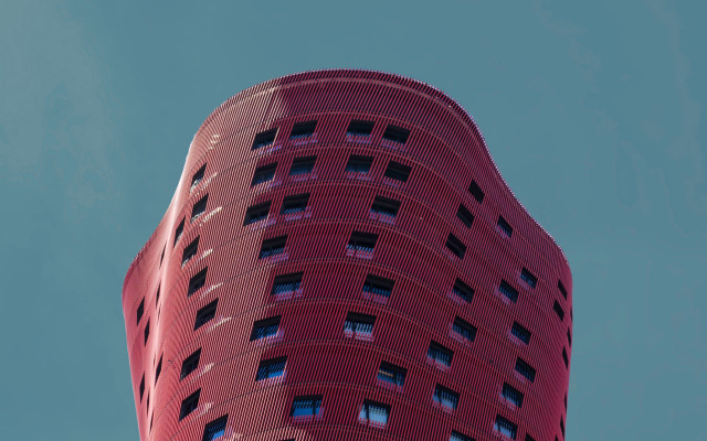 Tall red building sky plane free wallpaper for desktop - medium preview image