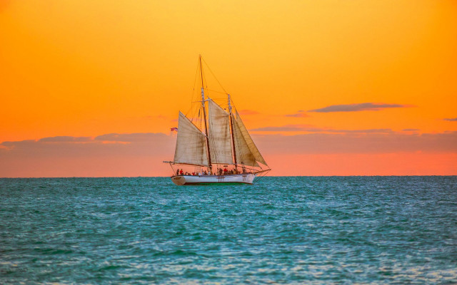 Sailboat sunset water reflection mountain free wallpaper for desktop - medium preview image