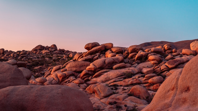 Rocky landscape grass blue sky free wallpaper for desktop - medium preview image
