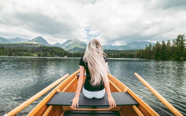 Woman boat lake mountains clouds free wallpaper for desktop - medium preview image