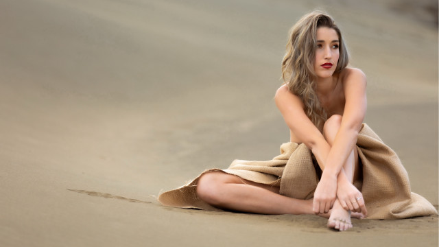 Woman beach towel sitting crossed free wallpaper for desktop - medium preview image