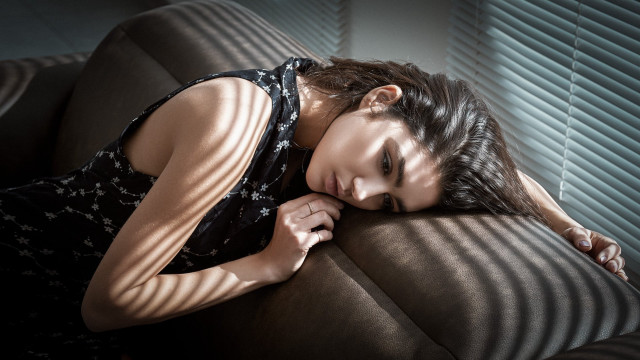 Woman couch lying somber blackhair free wallpaper for desktop - medium preview image