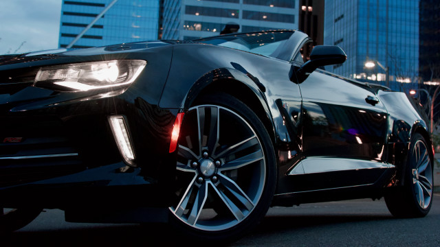 Black car tall building city free wallpaper for desktop - medium preview image