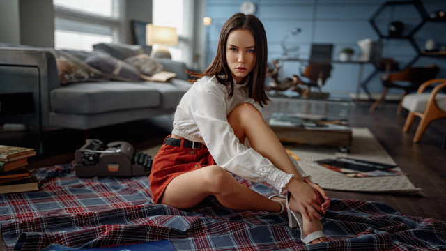 Woman sitting bed plaid couch free wallpaper for desktop - medium preview image