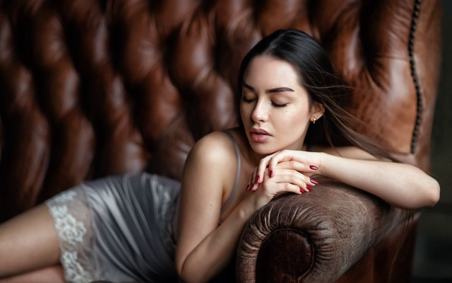Woman laying couch portrait blurry free wallpaper for desktop - medium preview image