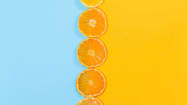 Orange slices yellow blue background free wallpaper for desktop - medium preview image