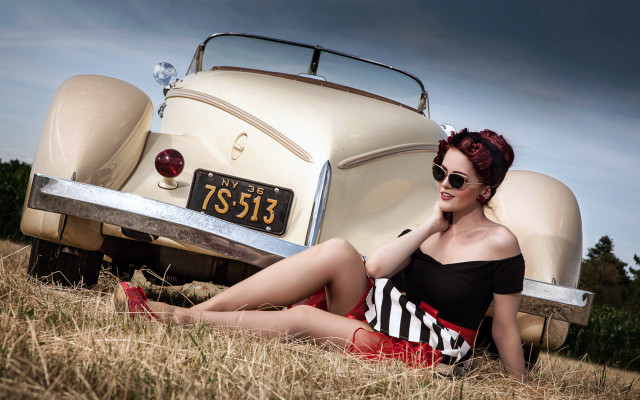 Red haired woman sitting car free wallpaper for desktop - medium preview image
